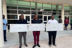 2023-Scholarship-3-recipients-holding-checks